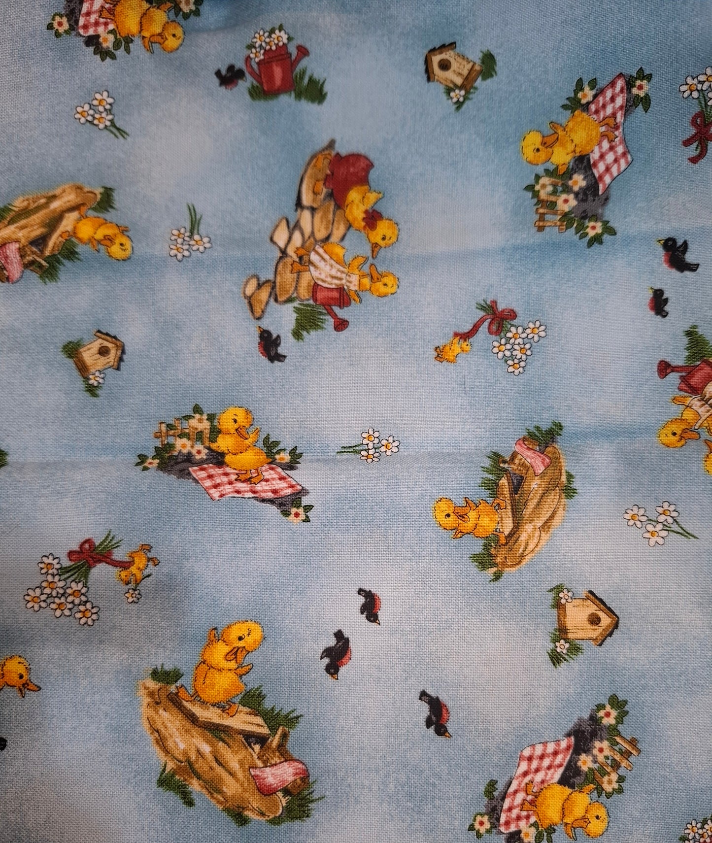 Tessuto azzurro con anatroccoli