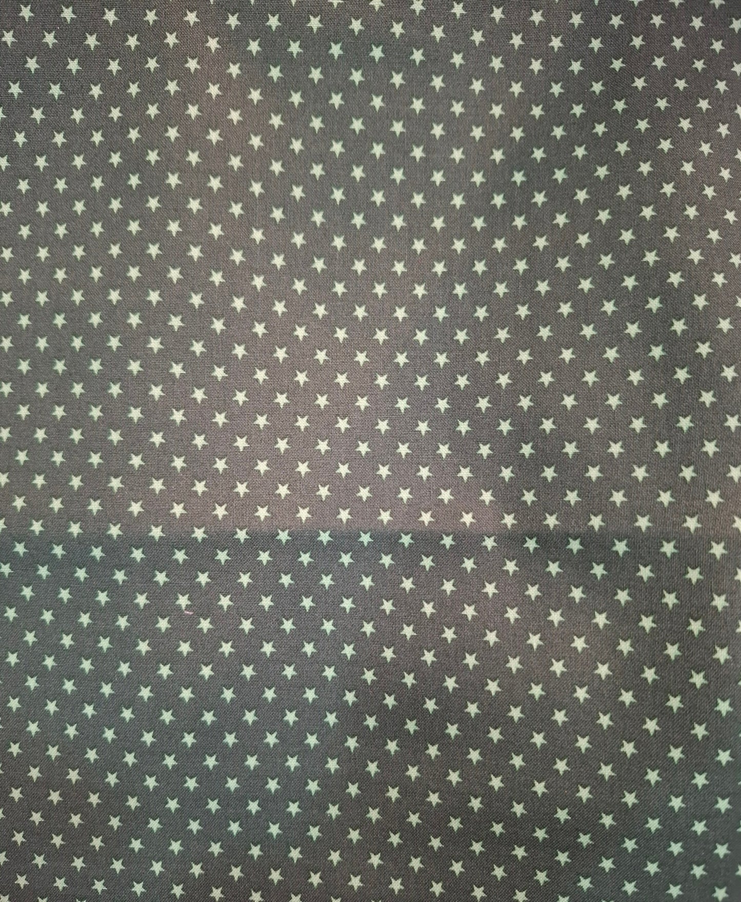 Tessuto cotone verde con stelle verdi