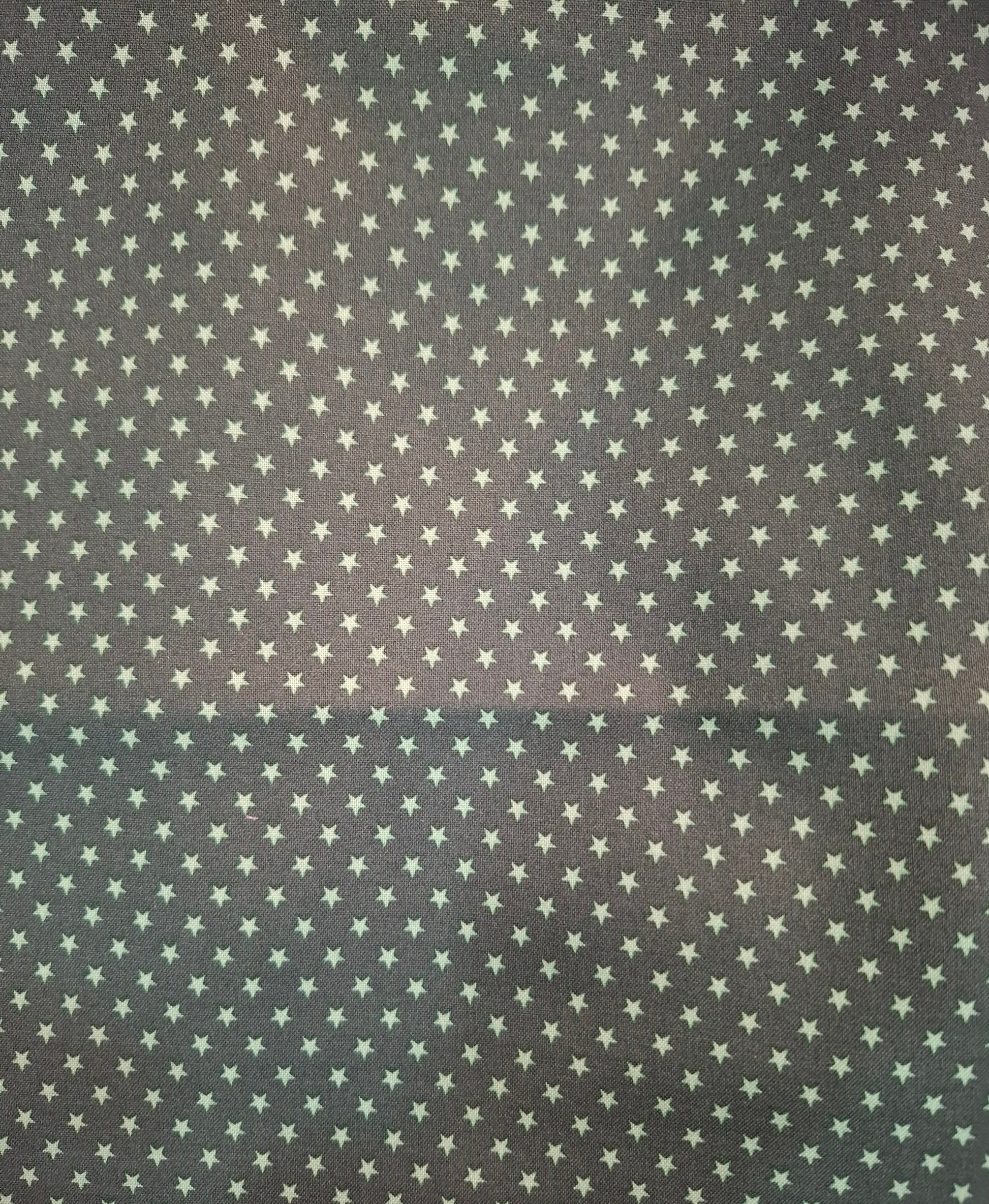 Tessuto cotone verde con stelle verdi