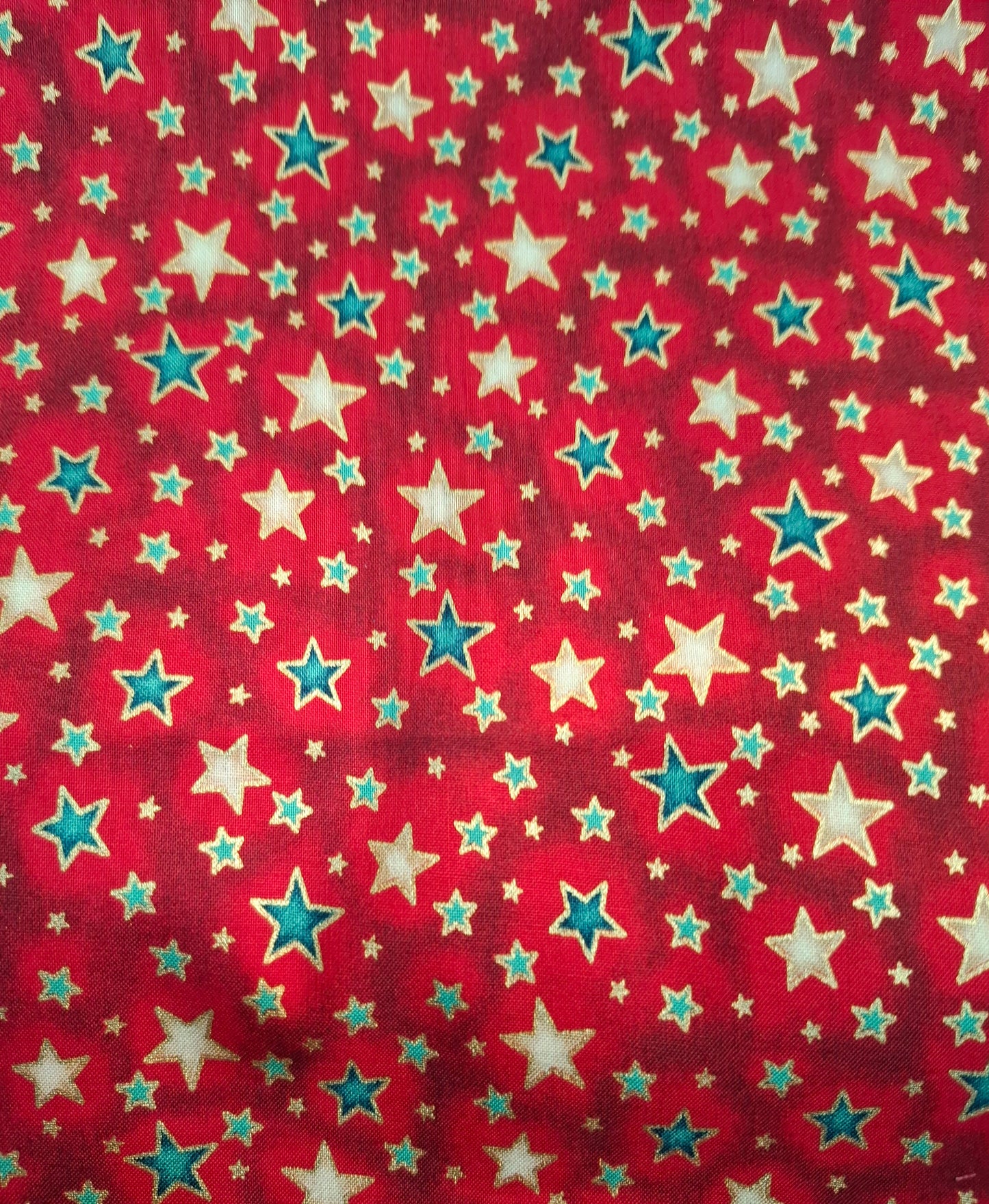 Tessuto rosso stelle oro e verdi