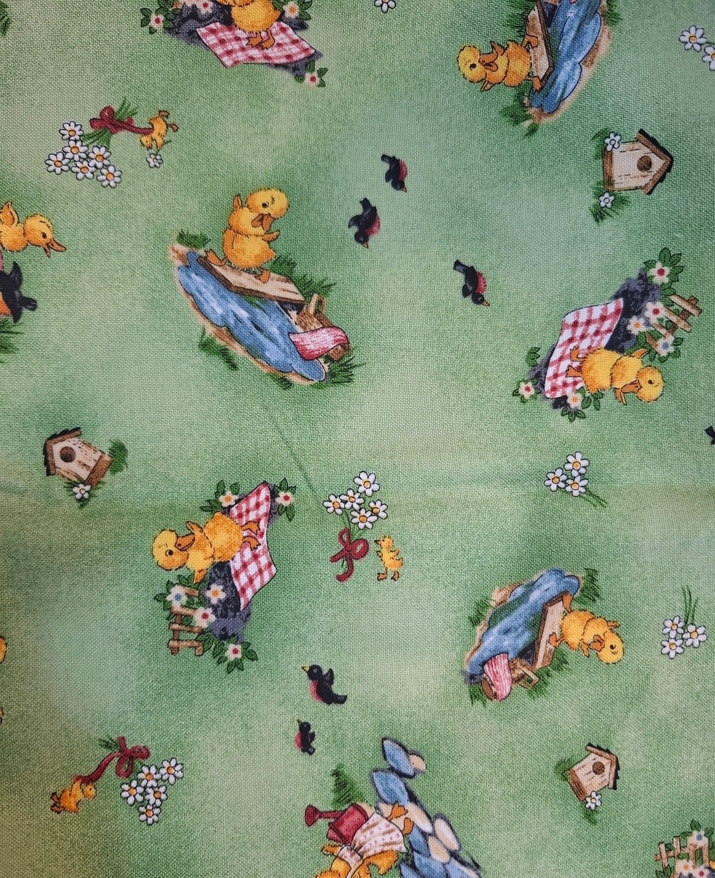 Tessuto verde con anatroccoli