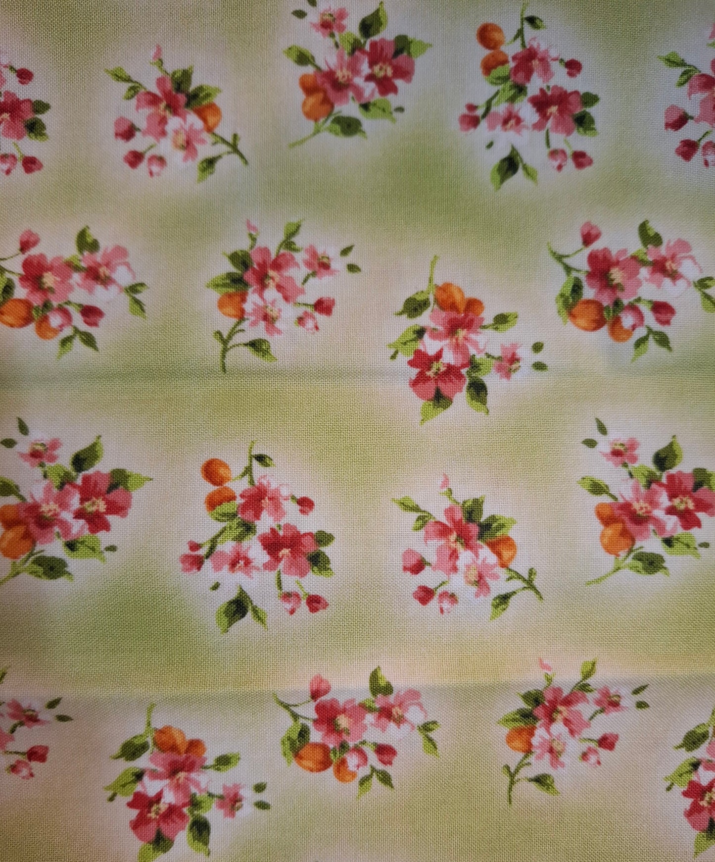 Tessuto verde con fiori