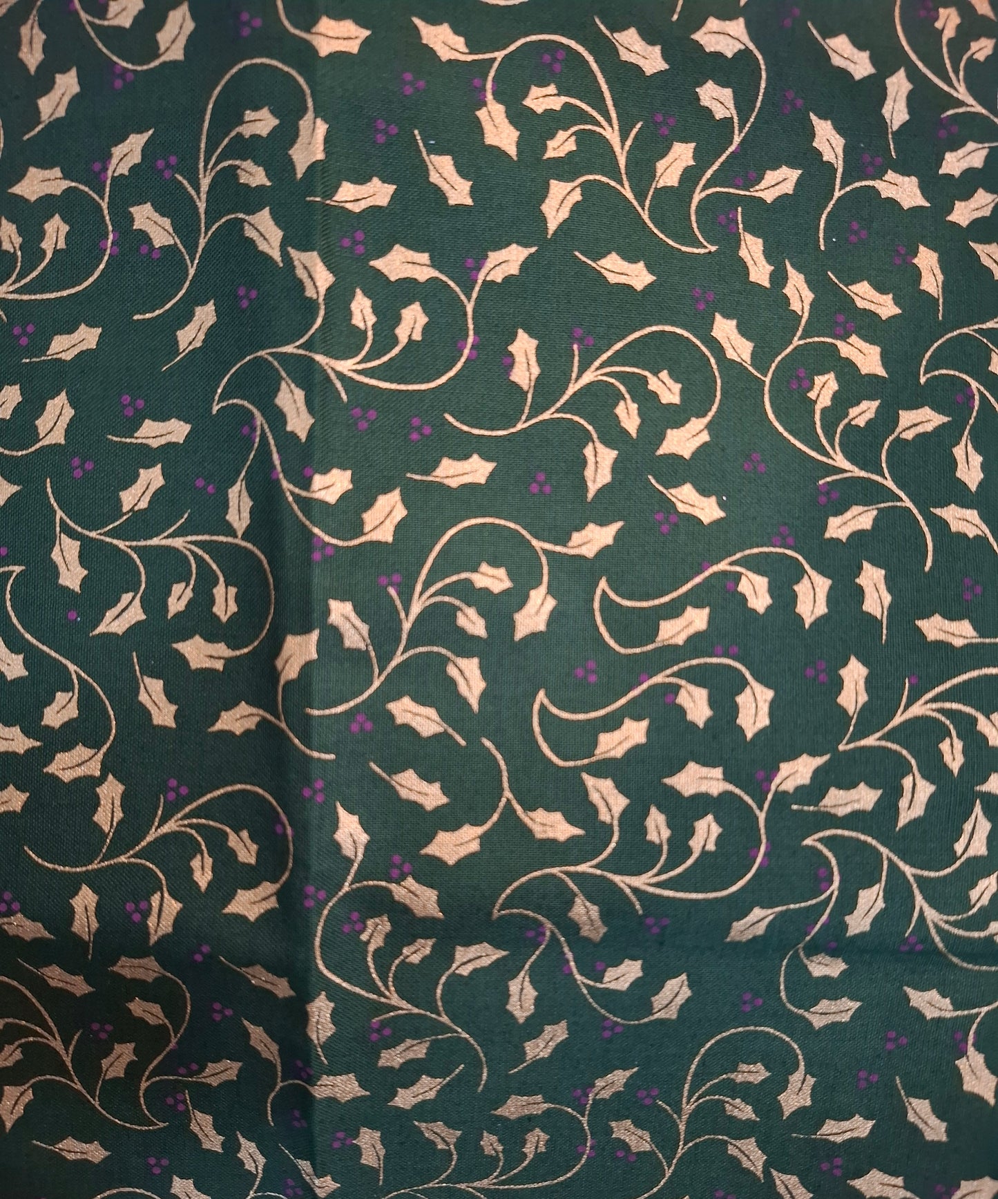 Tessuto verde con vischio dorato