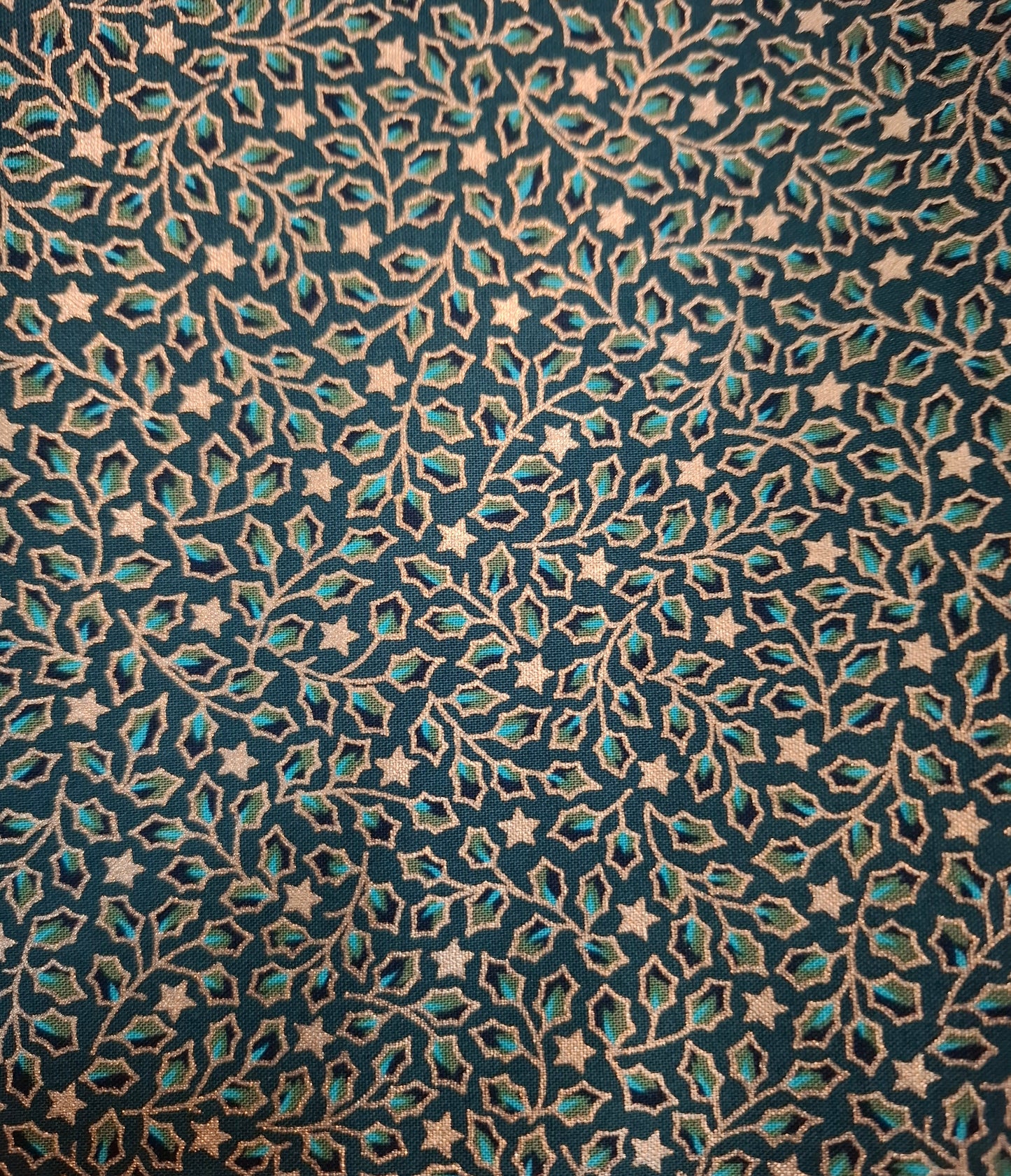 Tessuto verde vischio con stelle oro